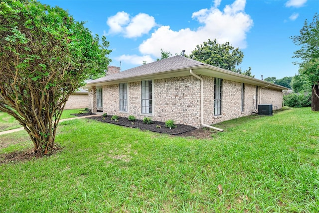 303 Randy Lee Ln, Mckinney, TX 75071 - view of side of property with central air condition unit, a lawn, a chimney, and brick siding