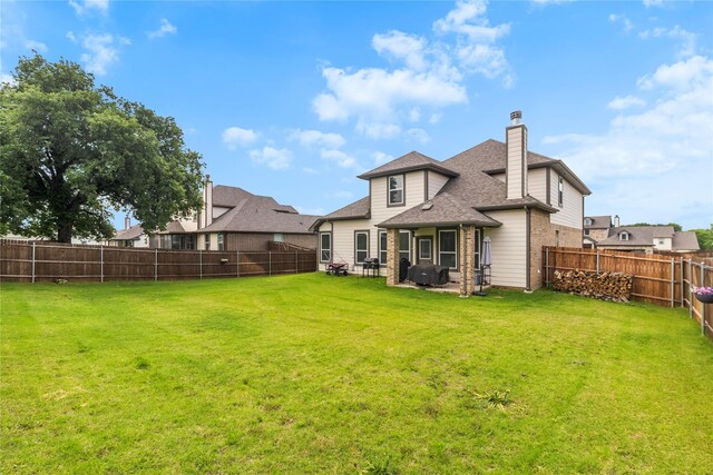 804 Feather Edge Dr, Springtown, TX 76082 - rear view of house with brick siding, a chimney, a patio, and a shingled roof