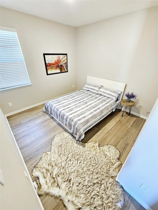 3405 Western Trl, Crandall, TX 75114 - bedroom featuring wood finished floors and baseboards