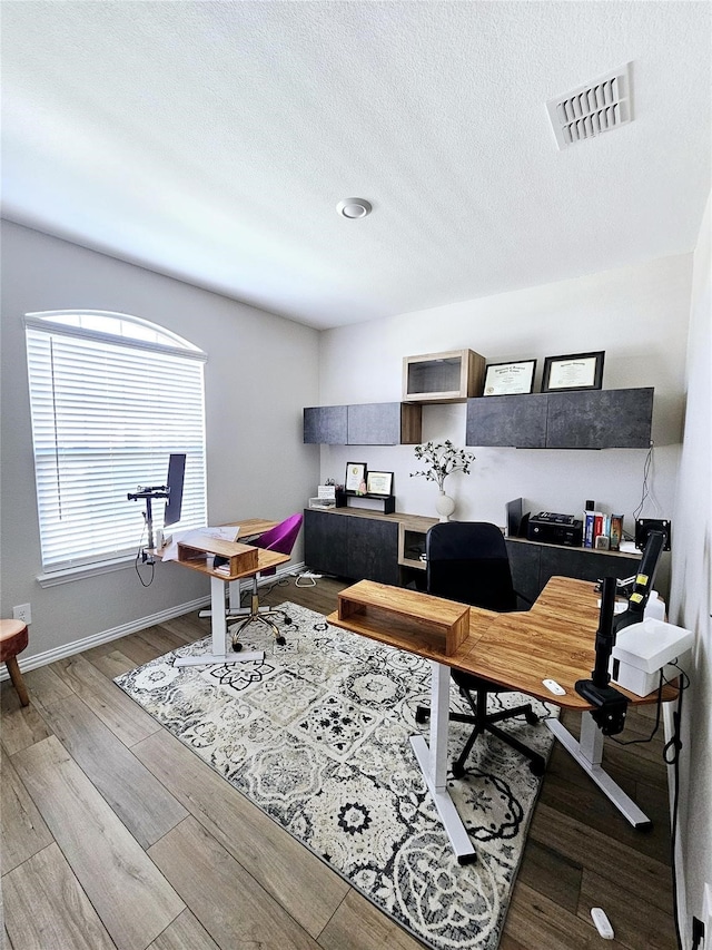3405 Western Trl, Crandall, TX 75114 - office space with a textured ceiling, wood finished floors, and baseboards