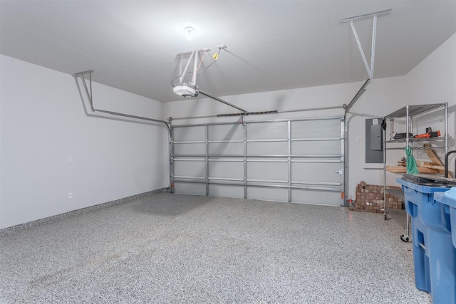 garage featuring electric panel and a garage door opener