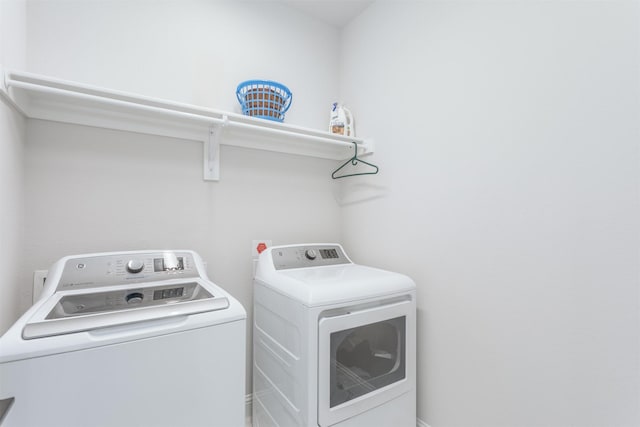 laundry room featuring washing machine and dryer
