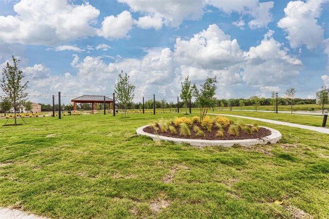 view of community with a gazebo and a yard