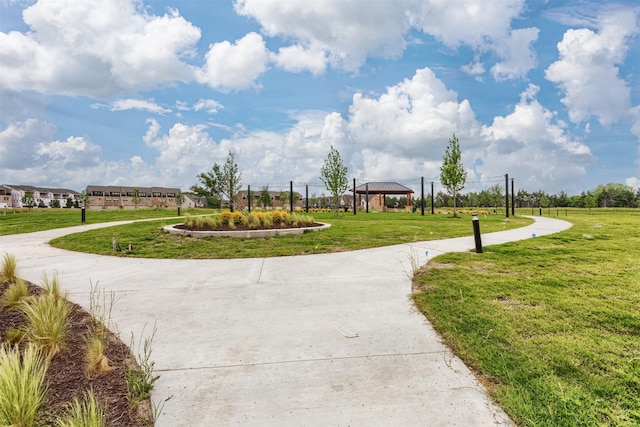 view of property's community with a gazebo and a yard