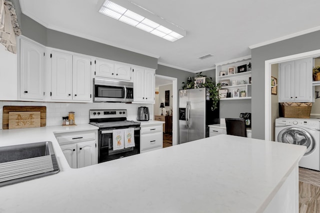 kitchen featuring appliances with stainless steel finishes, washer / clothes dryer, crown molding, backsplash, and open shelves