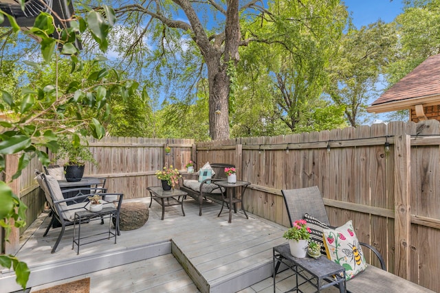 deck with a fenced backyard