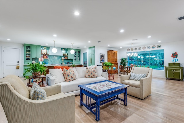 living room featuring recessed lighting and light wood finished floors