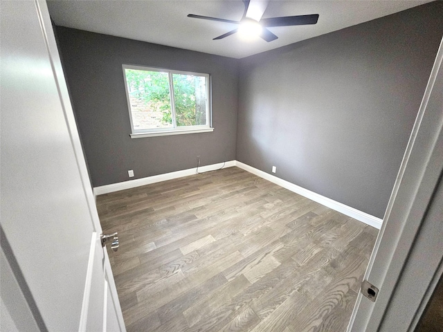 6604 Tabor St, North Richland Hills, TX 76180 - empty room with a ceiling fan, wood finished floors, and baseboards