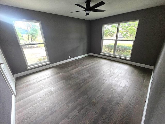 6604 Tabor St, North Richland Hills, TX 76180 - spare room featuring baseboards, dark wood-type flooring, and a ceiling fan