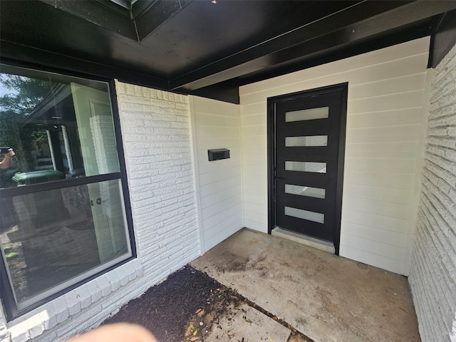 6604 Tabor St, North Richland Hills, TX 76180 - property entrance featuring brick siding