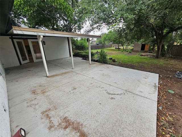 6604 Tabor St, North Richland Hills, TX 76180 - view of patio / terrace with fence and a carport