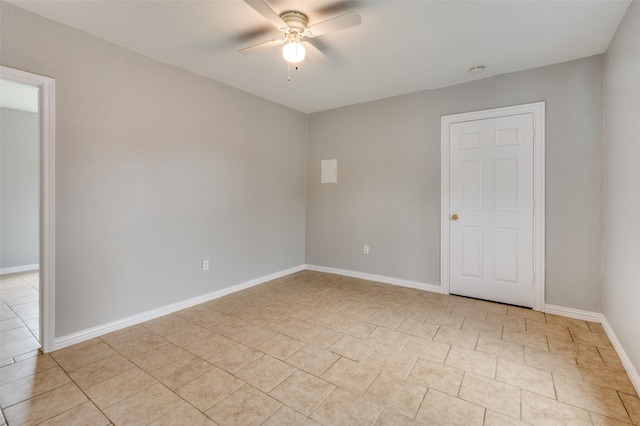 2524 Malvern Trl, Fort Worth, TX 76105 - unfurnished room with ceiling fan, light tile patterned flooring, baseboards, and a smoke detector