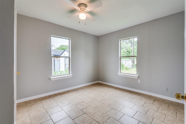 2524 Malvern Trl, Fort Worth, TX 76105 - empty room with light tile patterned floors, ceiling fan, and baseboards