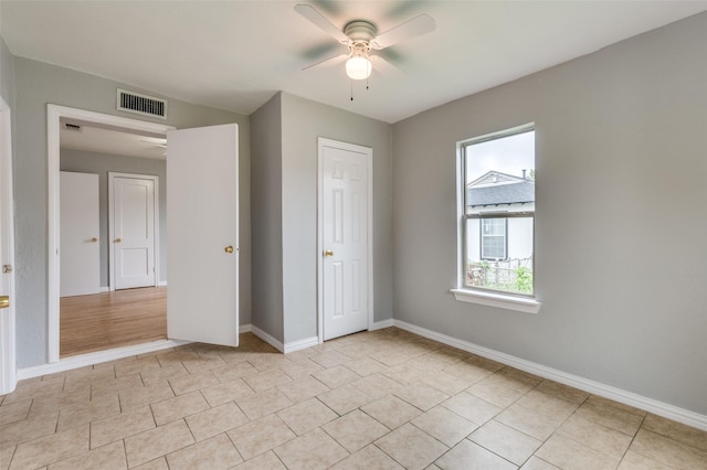 2524 Malvern Trl, Fort Worth, TX 76105 - unfurnished bedroom featuring light tile patterned floors, baseboards, and a ceiling fan