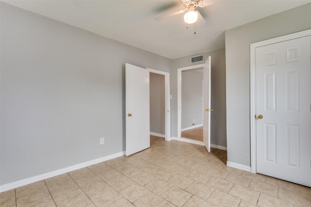 2524 Malvern Trl, Fort Worth, TX 76105 - unfurnished bedroom featuring light tile patterned floors, ceiling fan, and baseboards