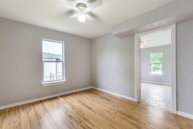 2524 Malvern Trl, Fort Worth, TX 76105 - spare room with ceiling fan, light wood-style flooring, and baseboards