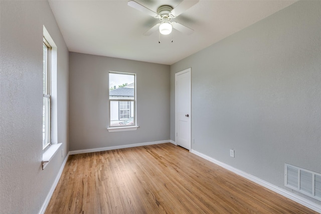 2524 Malvern Trl, Fort Worth, TX 76105 - empty room featuring light wood-type flooring, ceiling fan, and baseboards