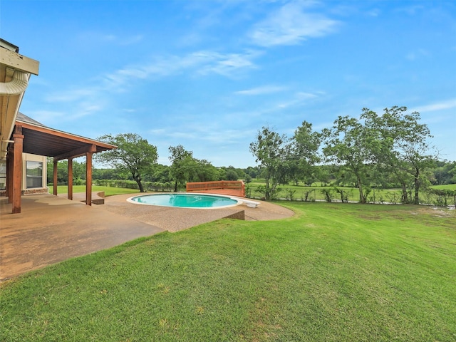 outdoor pool with a patio and a lawn