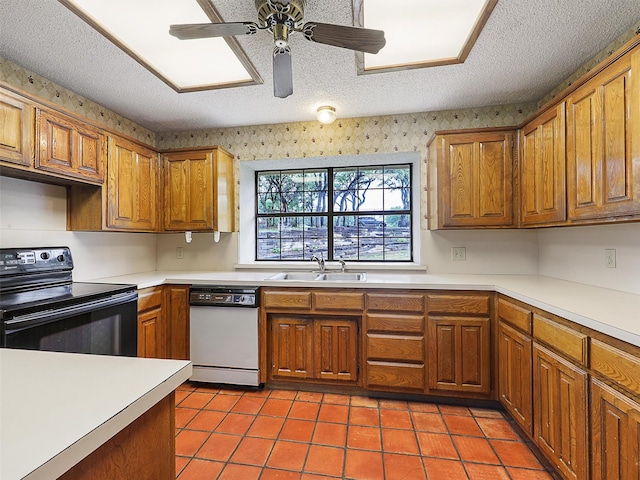 302 Fairway Ct, Willow Park, TX 76087 - kitchen with white dishwasher, black electric range, a sink, brown cabinets, and light countertops