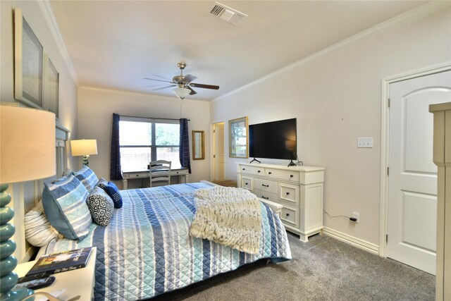 bedroom with carpet floors, ornamental molding, baseboards, and a ceiling fan