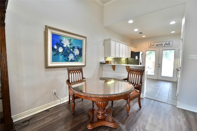 dining space with dark wood-style flooring, baseboards, recessed lighting, french doors, and ornamental molding