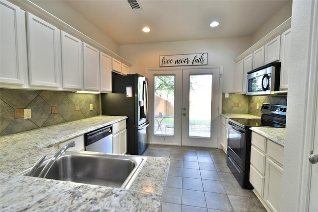 kitchen featuring black appliances, a sink, white cabinetry, french doors, and recessed lighting