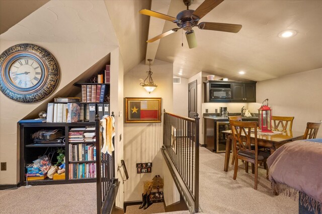 dining area featuring light colored carpet, a ceiling fan, vaulted ceiling, and recessed lighting