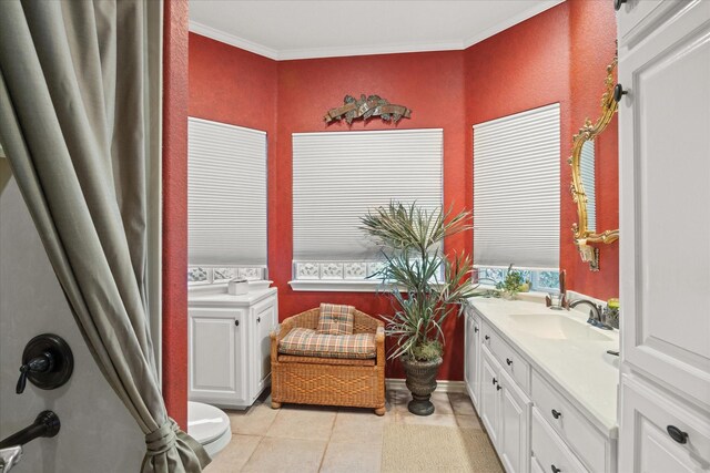 bathroom with vanity, ornamental molding, tile patterned flooring, and a textured wall