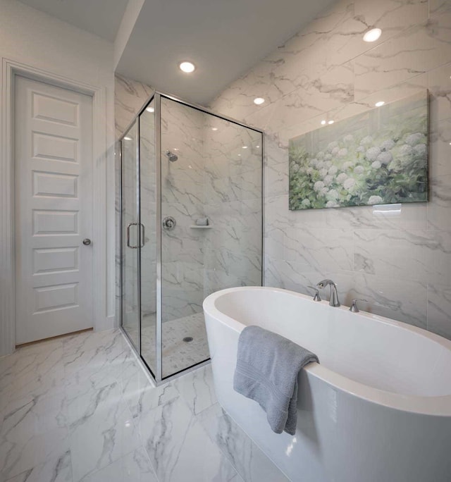 2210 Desmond Dr, Forney, TX 75126 - full bathroom with a marble finish shower, a freestanding tub, marble finish floors, and recessed lighting