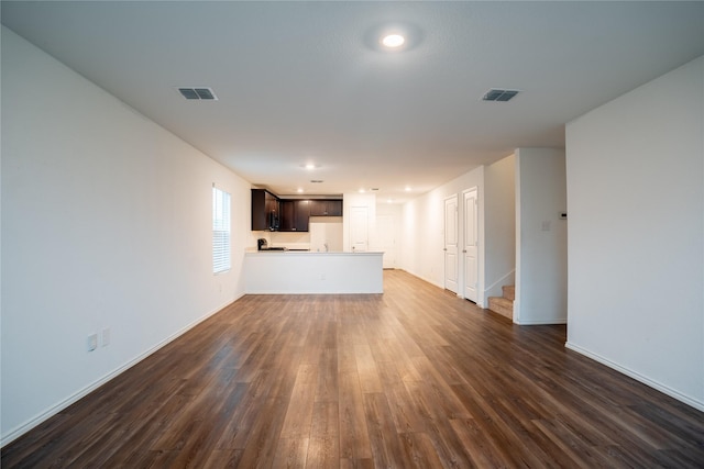 2923 Cascade Ln, Forney, TX 75126 - unfurnished living room with dark wood-type flooring, baseboards, stairway, and recessed lighting