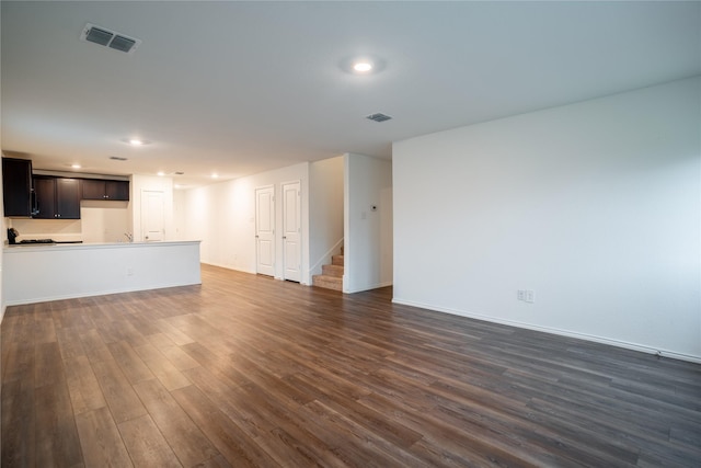 2923 Cascade Ln, Forney, TX 75126 - unfurnished living room with stairs, dark wood-style floors, recessed lighting, and baseboards