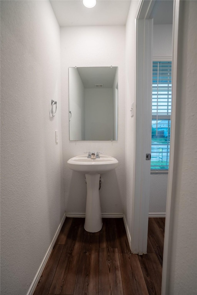 2923 Cascade Ln, Forney, TX 75126 - bathroom featuring baseboards and wood finished floors