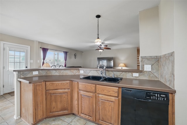 kitchen featuring black dishwasher, a sink, a ceiling fan, tasteful backsplash, and pendant lighting