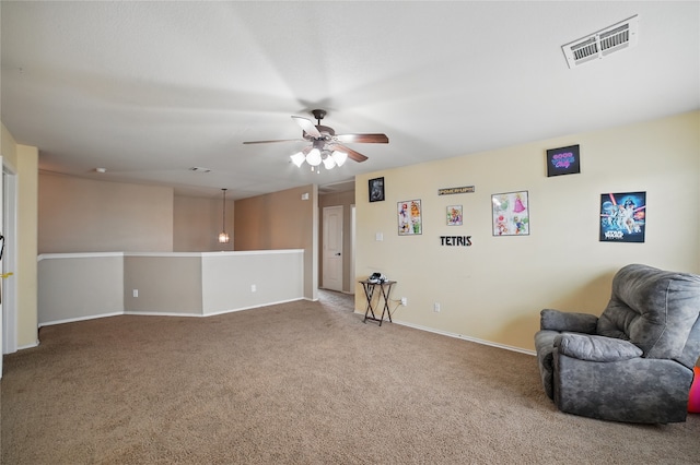 unfurnished room with carpet, ceiling fan, and baseboards