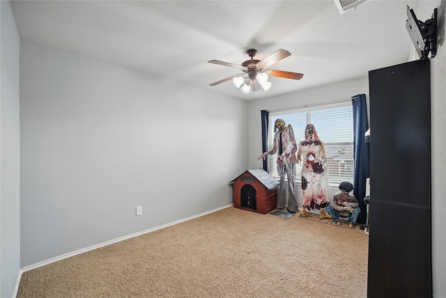 game room with carpet flooring, a ceiling fan, and baseboards