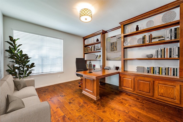 home office featuring baseboards and dark wood-type flooring