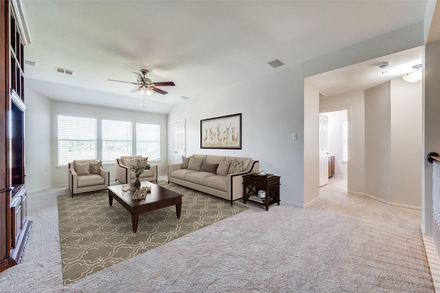 living room featuring a ceiling fan, carpet flooring, and baseboards