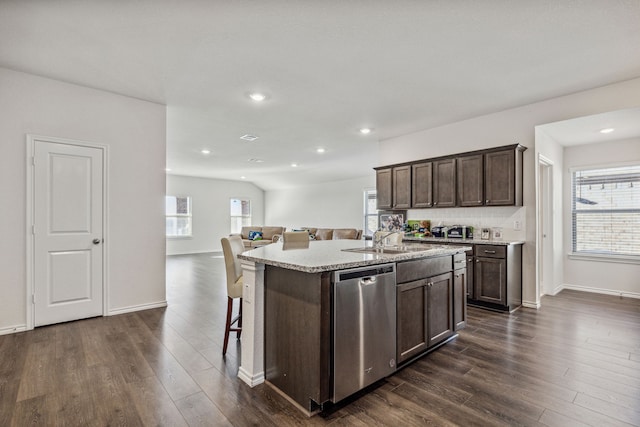 3936 Burks Ct, Celina, TX 75009 - kitchen with dishwasher, a sink, dark brown cabinetry, an island with sink, and dark wood-type flooring