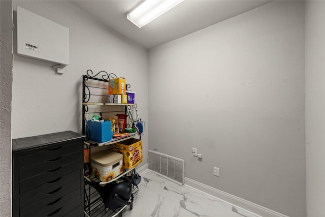 209 Village Cir, Waco, TX 76710 - miscellaneous room featuring marble look tile flooring and baseboards