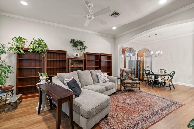 209 Village Cir, Waco, TX 76710 - living area featuring arched walkways, light wood finished floors, a chandelier, recessed lighting, and baseboards