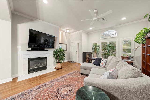 209 Village Cir, Waco, TX 76710 - living room with wood finished floors, recessed lighting, ceiling fan, ornamental molding, and a premium fireplace