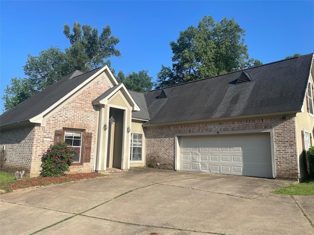 2127 Forest Hills Blvd, Haughton, LA 71037 - view of front facade featuring brick siding, concrete driveway, a garage, and roof with shingles