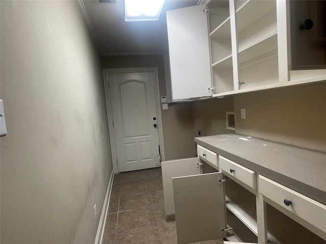 2127 Forest Hills Blvd, Haughton, LA 71037 - laundry area featuring cabinet space, hookup for an electric dryer, ornamental molding, washer hookup, and baseboards