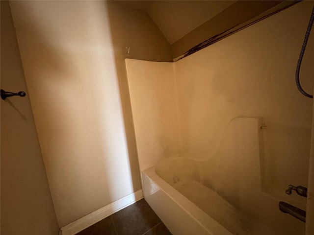 2127 Forest Hills Blvd, Haughton, LA 71037 - bathroom with tile patterned floors, lofted ceiling, and baseboards