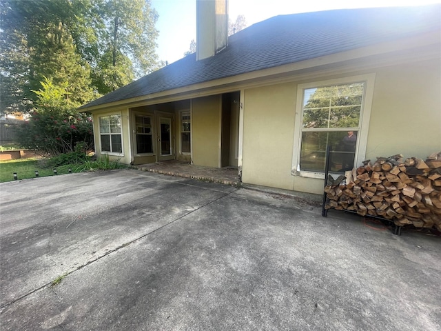 2127 Forest Hills Blvd, Haughton, LA 71037 - rear view of house featuring a patio and stucco siding