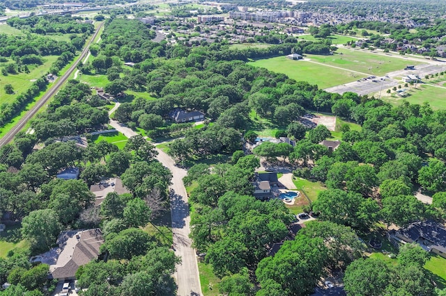 aerial overview of property's location with a tree filled landscape