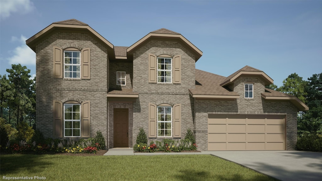 805 Split Oak Ln, Anna, TX 75409 - view of front facade with brick siding, an attached garage, concrete driveway, and a front lawn
