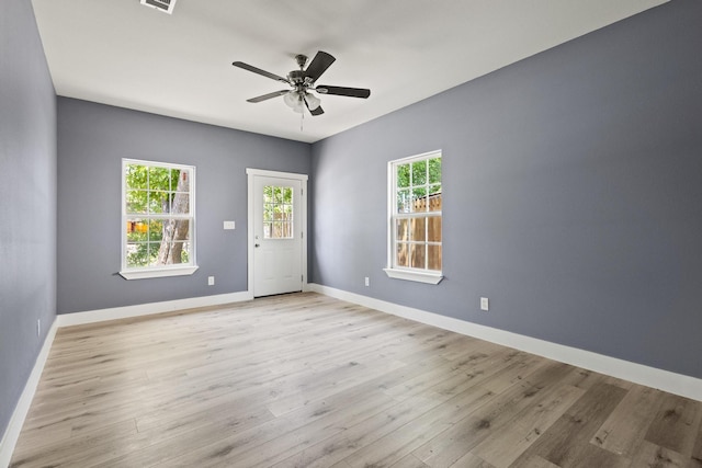 620 S First St, Sherman, TX 75090 - spare room featuring ceiling fan, plenty of natural light, baseboards, and wood finished floors