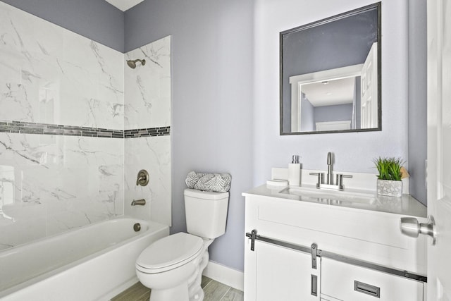 620 S First St, Sherman, TX 75090 - bathroom with toilet, vanity, shower / bath combination, baseboards, and wood finished floors