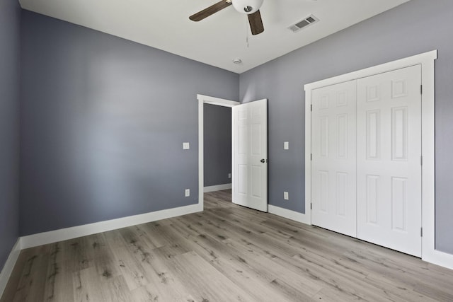 620 S First St, Sherman, TX 75090 - unfurnished bedroom featuring wood finished floors, a closet, baseboards, and a ceiling fan